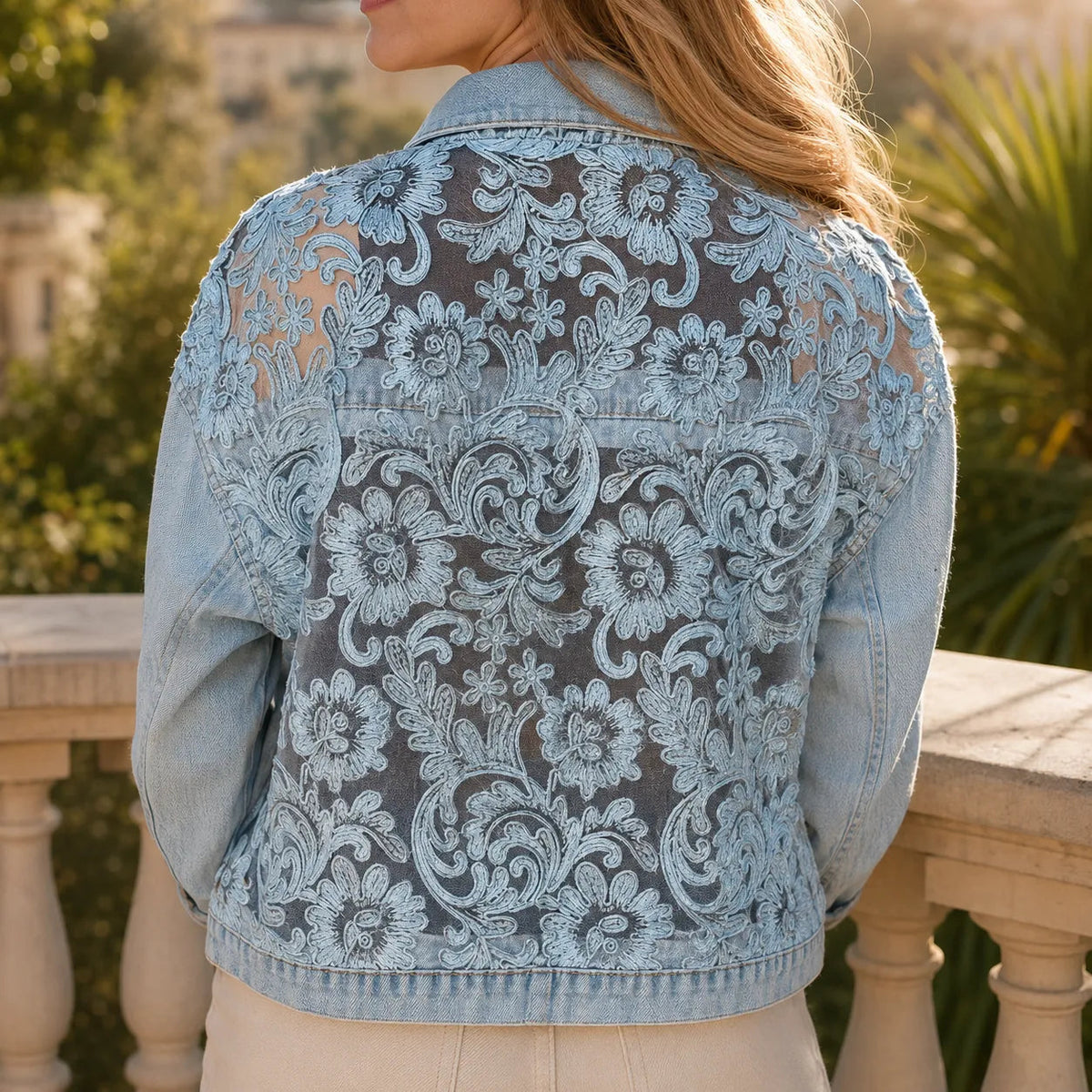 Back view light blue denim jacket with lace-look floral embroidery and yoke panel