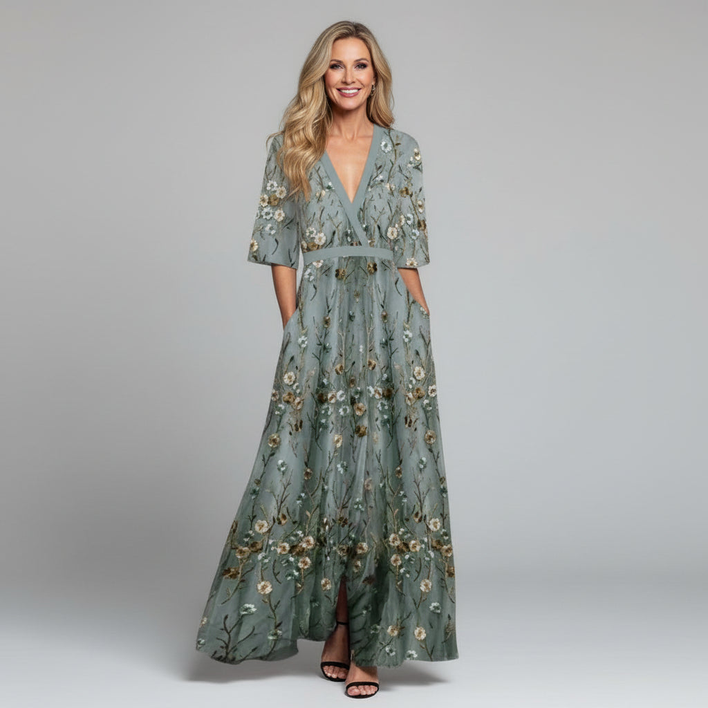 Sage green floral maxi dress with V-neck, three-quarter sleeves, and belted waist