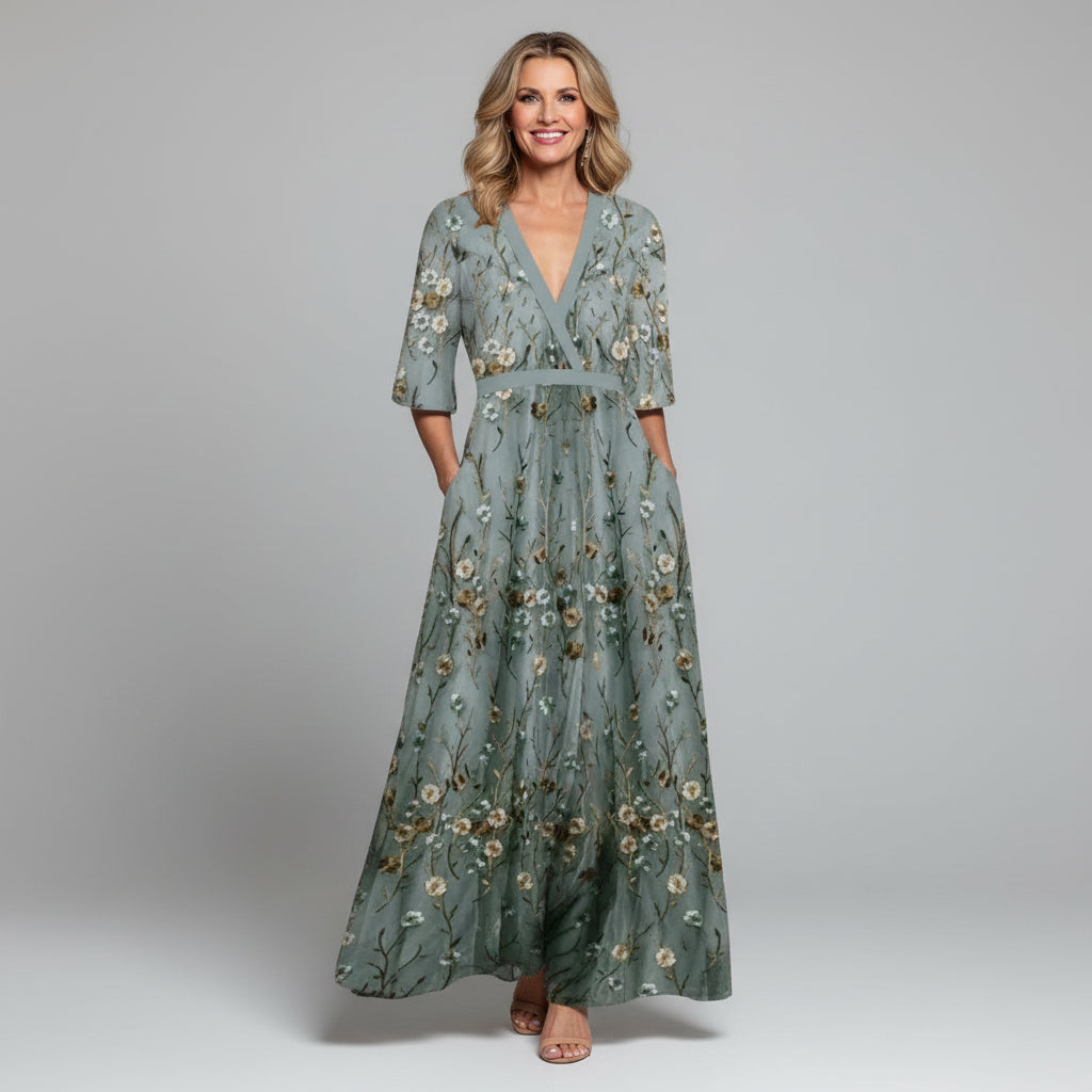 Sage green floral maxi dress with V-neck, three-quarter sleeves, belted waist, flowing skirt