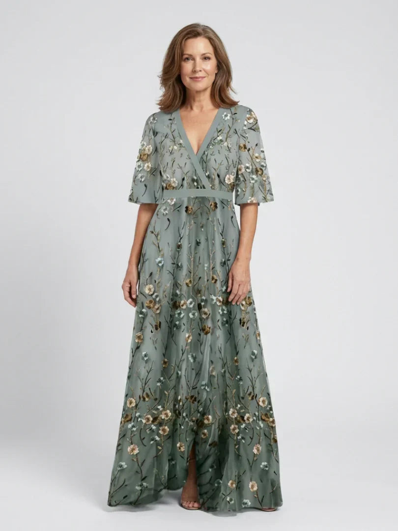 Sage green floral maxi dress with V-neck, three-quarter sleeves, and gathered full skirt