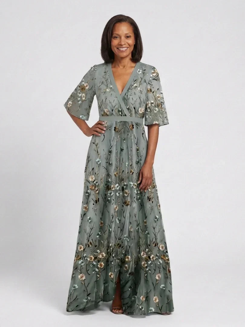 Sage green floral maxi dress with V-neck, three-quarter sleeves, belted waist, full skirt