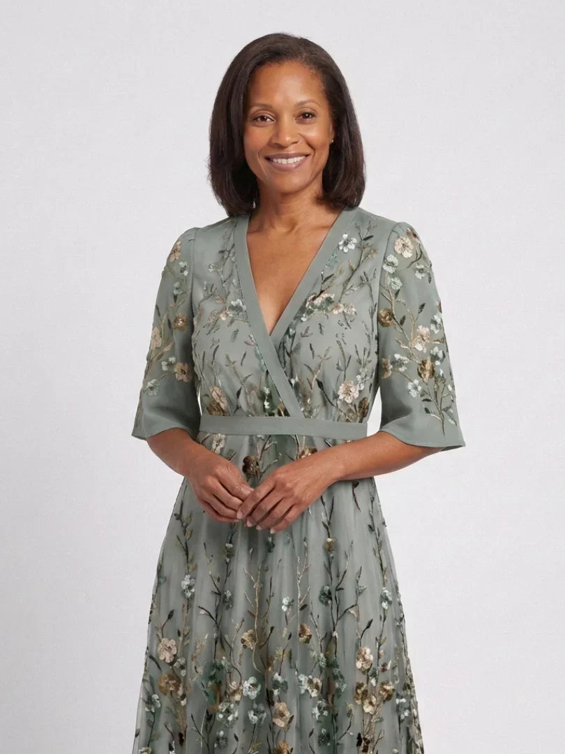 Sage green floral maxi dress with V-neck, three-quarter sleeves, and belted waist
