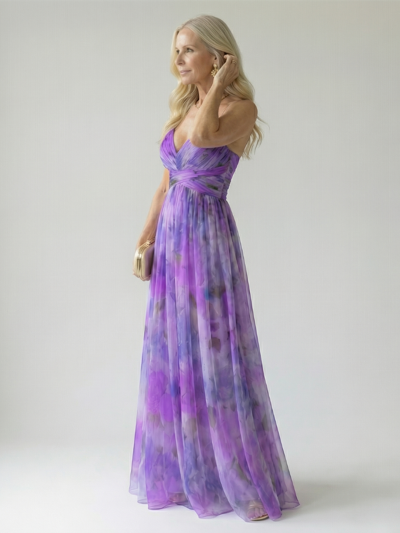 Purple wrap maxi dress with V-neck and spaghetti straps, full skirt in motion