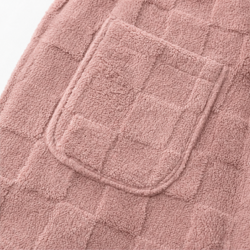 Close-up of pink fluffy checked cardigan with patch pocket detail