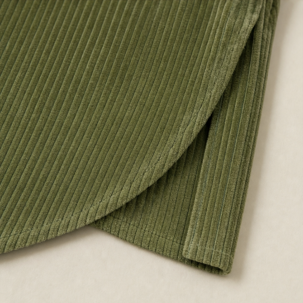 Olive green corduroy top front with asymmetric overlap and ribbed texture