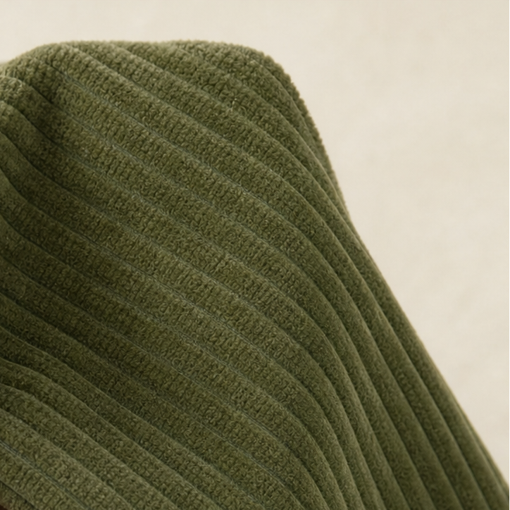 Close-up of olive green ribbed corduroy fabric weave