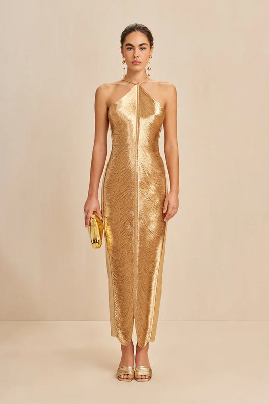 Gold halter maxi dress with open back, metallic sheen and fringe hem
