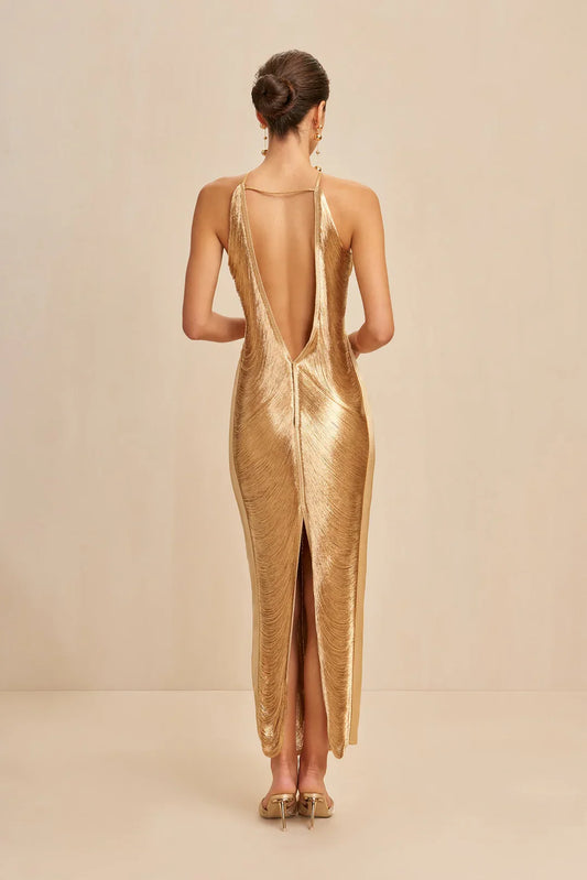 Gold halter maxi dress, open-back view with long fringe detailing at sides