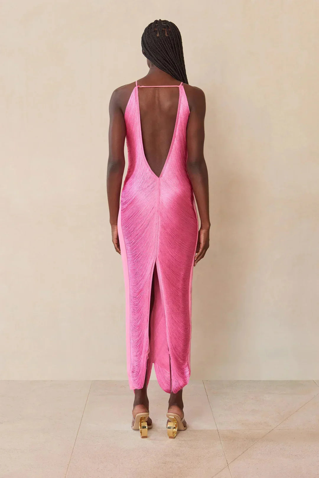 Pink halter maxi dress, open V-back and center slit at the hem