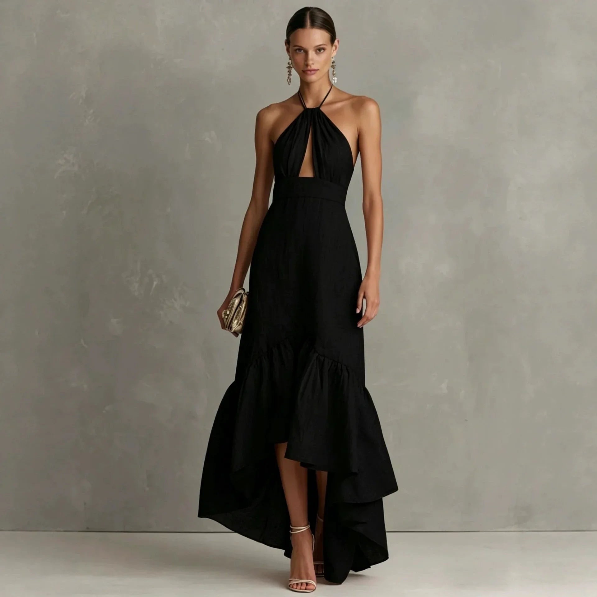 Black halter maxi dress with keyhole cutout and tiered asymmetric hem
