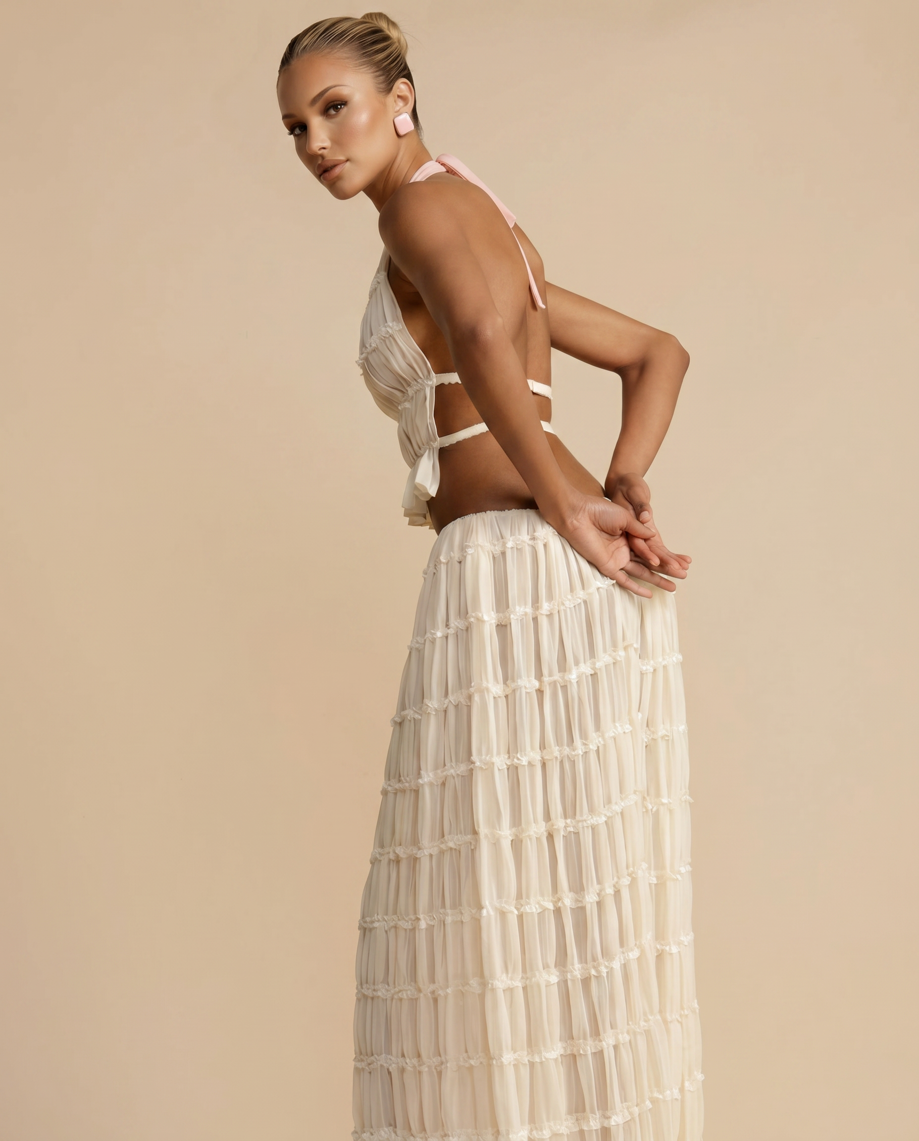 Ivory halter crop top with back tie and pleated tiered maxi skirt