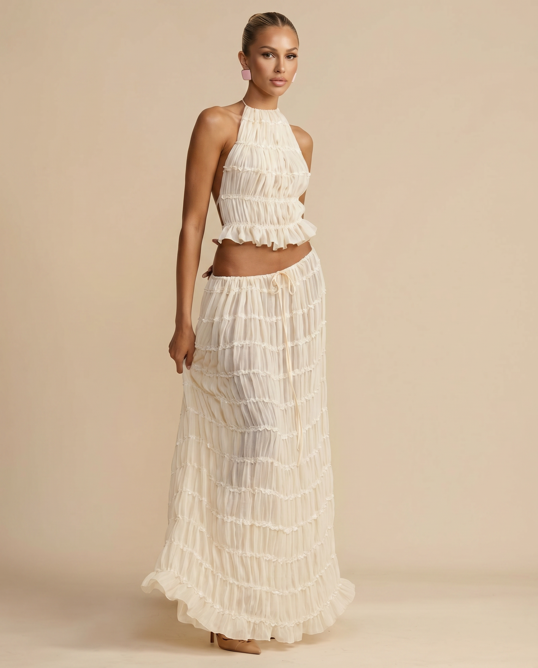Ivory halter crop top and flowing pleated tiered maxi skirt