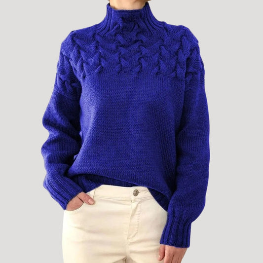 Blue cable knit sweater with high neck and textured braid pattern, long sleeves