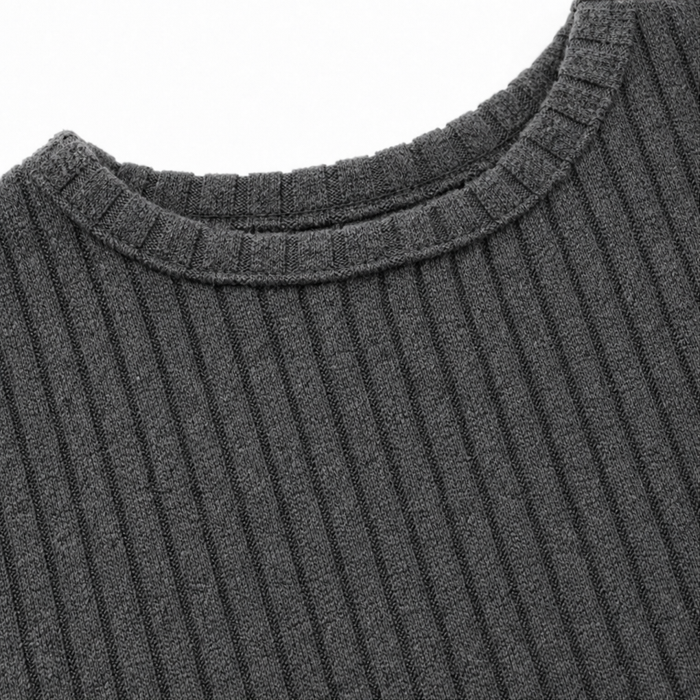 Close-up: gray ribbed knit round neckline and curved yoke on midi dress