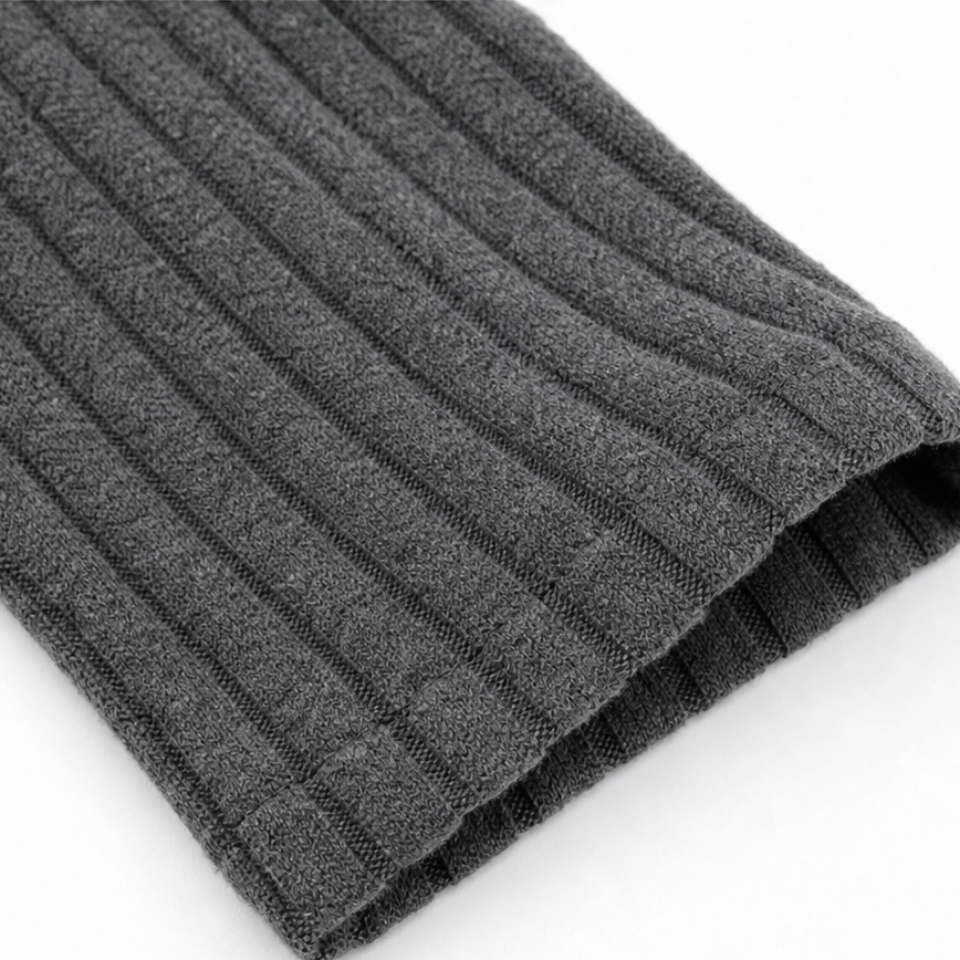 Close-up: gray ribbed knit hem on midi dress with folded cuff edge