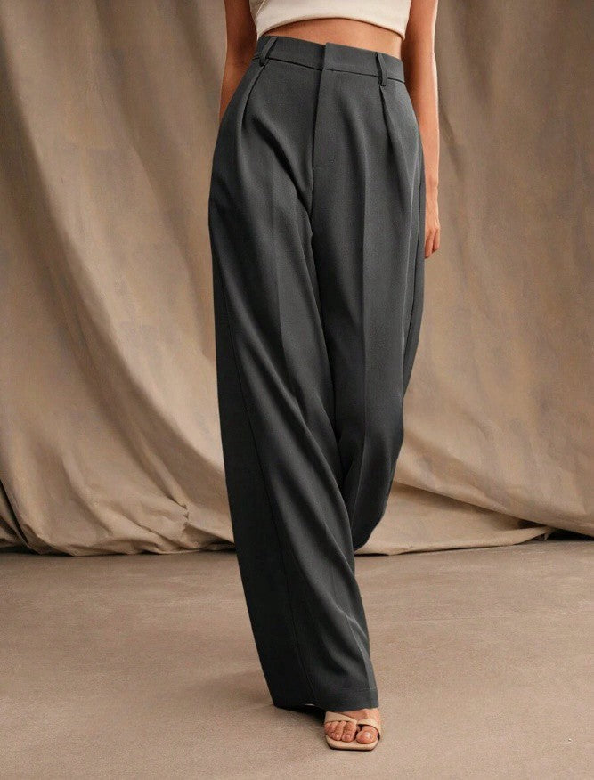 Dark high-waist wide-leg tailored trousers with belt loops and tailored crease