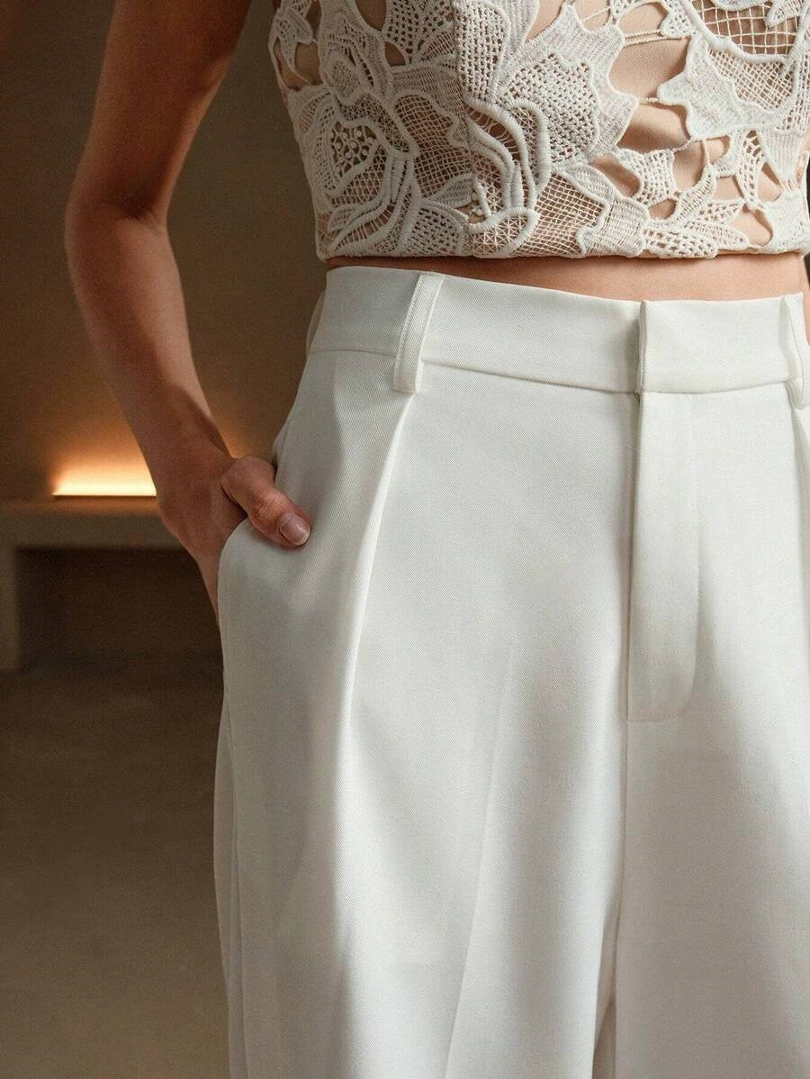 Cream wide-leg tailored trousers with pressed front crease and belt loops