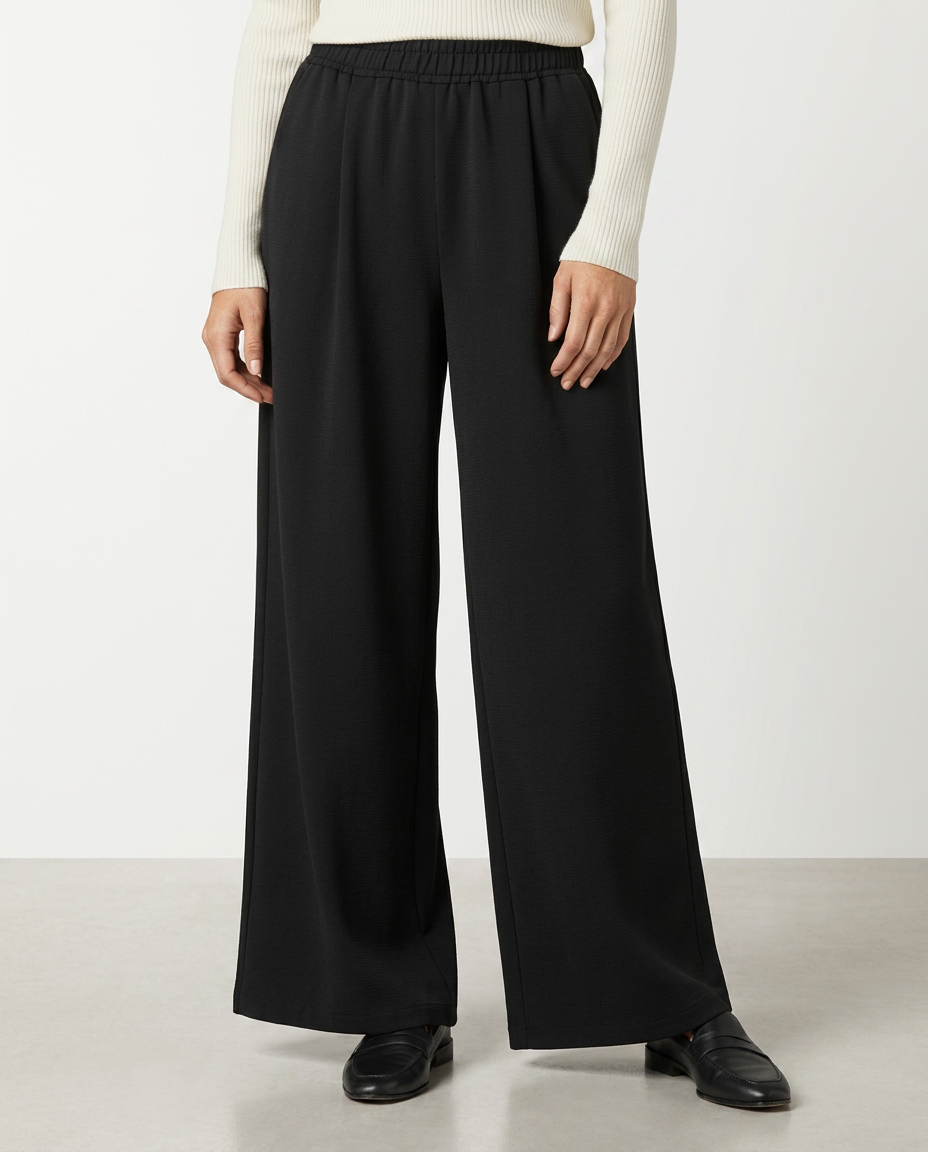 Black high-waist wide-leg trousers with elastic waistband and relaxed straight legs