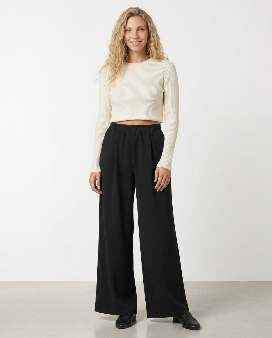 Black high-waist wide-leg trousers with elastic waistband and wide ankle hems