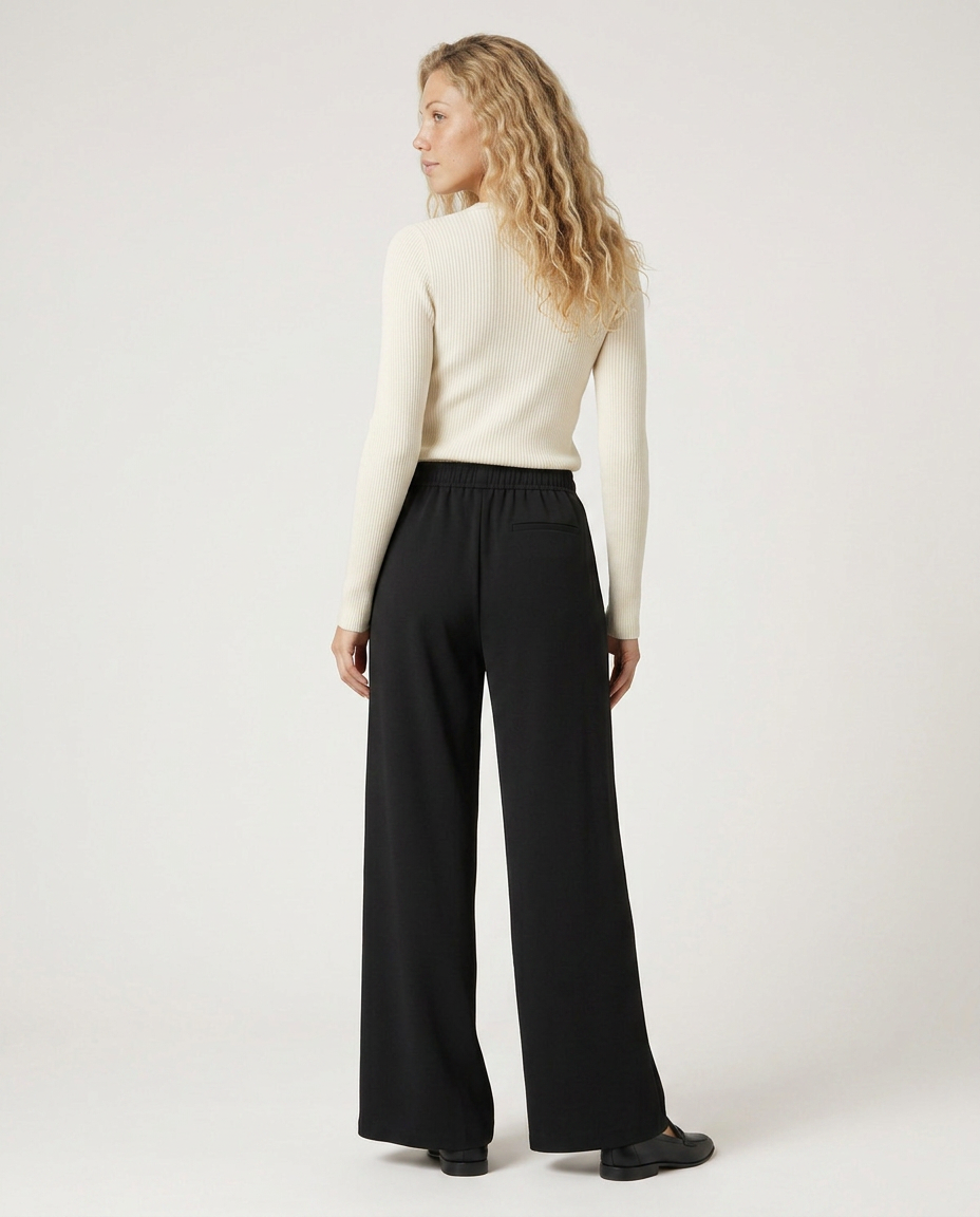 Black high-waist wide-leg trousers with elastic waistband and wide straight legs