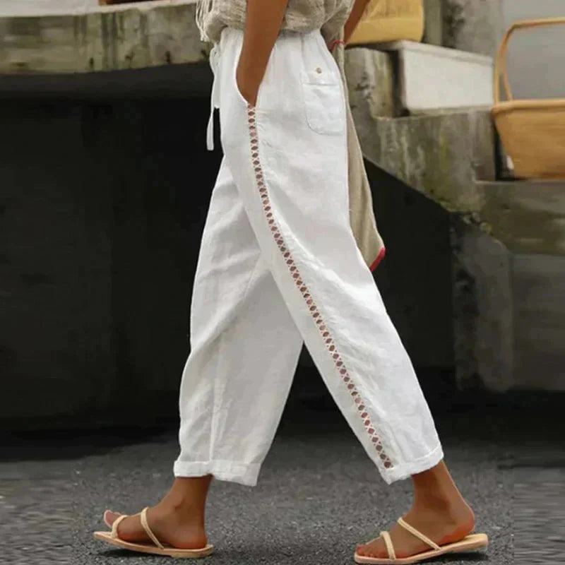 High-waisted tapered trousers in white with side button stripe