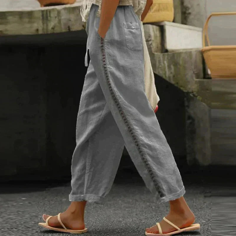 High-waisted tapered trousers in gray with side button stripe