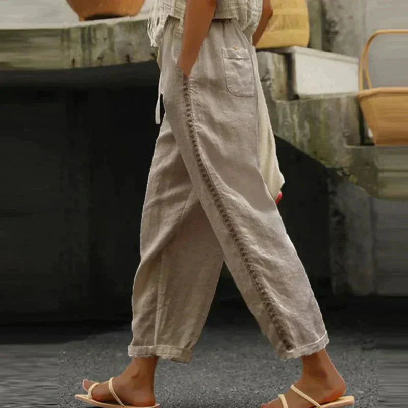 High-waisted tapered trousers in khaki with side button stripe