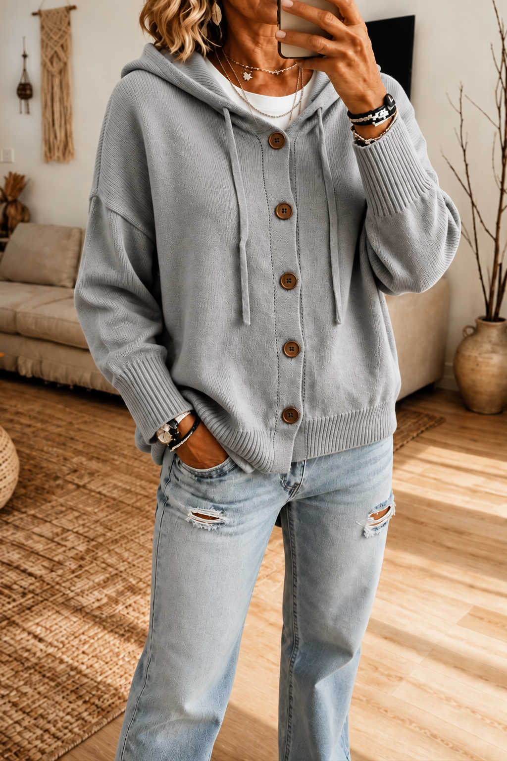 Gray hooded rib-knit cardigan with drawstrings, brown buttons, and ribbed cuffs and hem