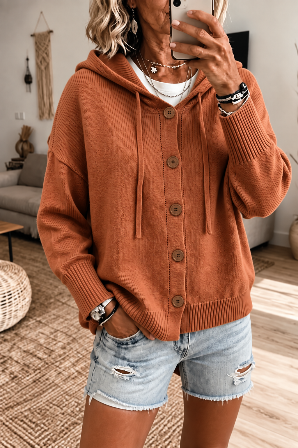 Apricot hooded rib-knit cardigan with drawstrings, brown buttons, and ribbed cuffs and hem