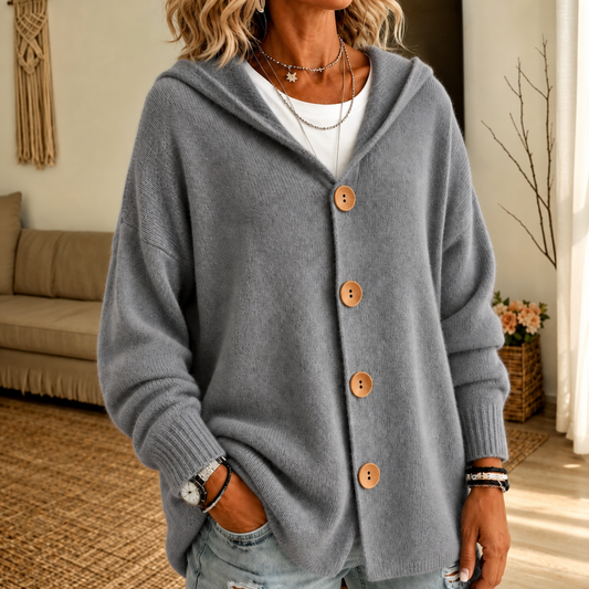 Close-up of gray hooded cardigan with wooden buttons and ribbed cuffs