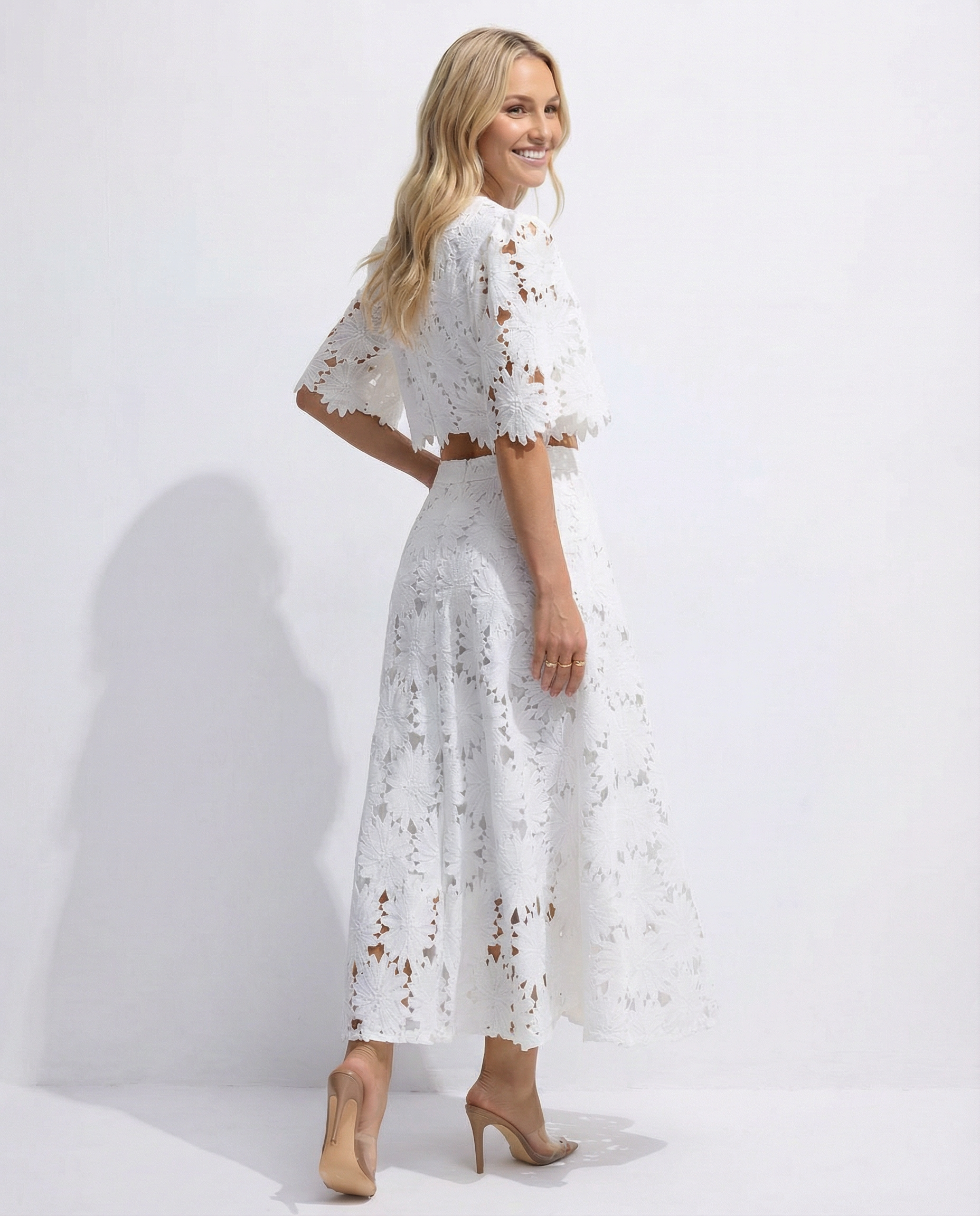 White lace crop top and maxi skirt set with floral embroidery, side view