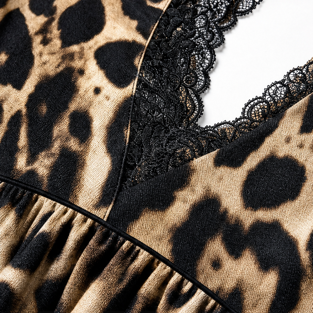Black lace trim along V-neckline on leopard print fabric