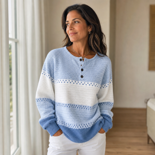 Light blue and white henley sweater with dark button placket and long sleeves