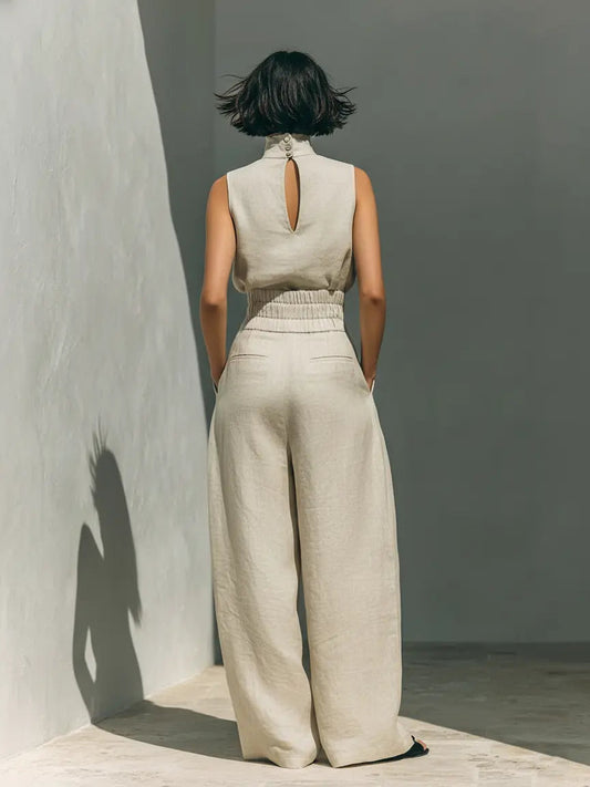 Linen high-neck sleeveless set in light cream with open back and wide-leg trousers