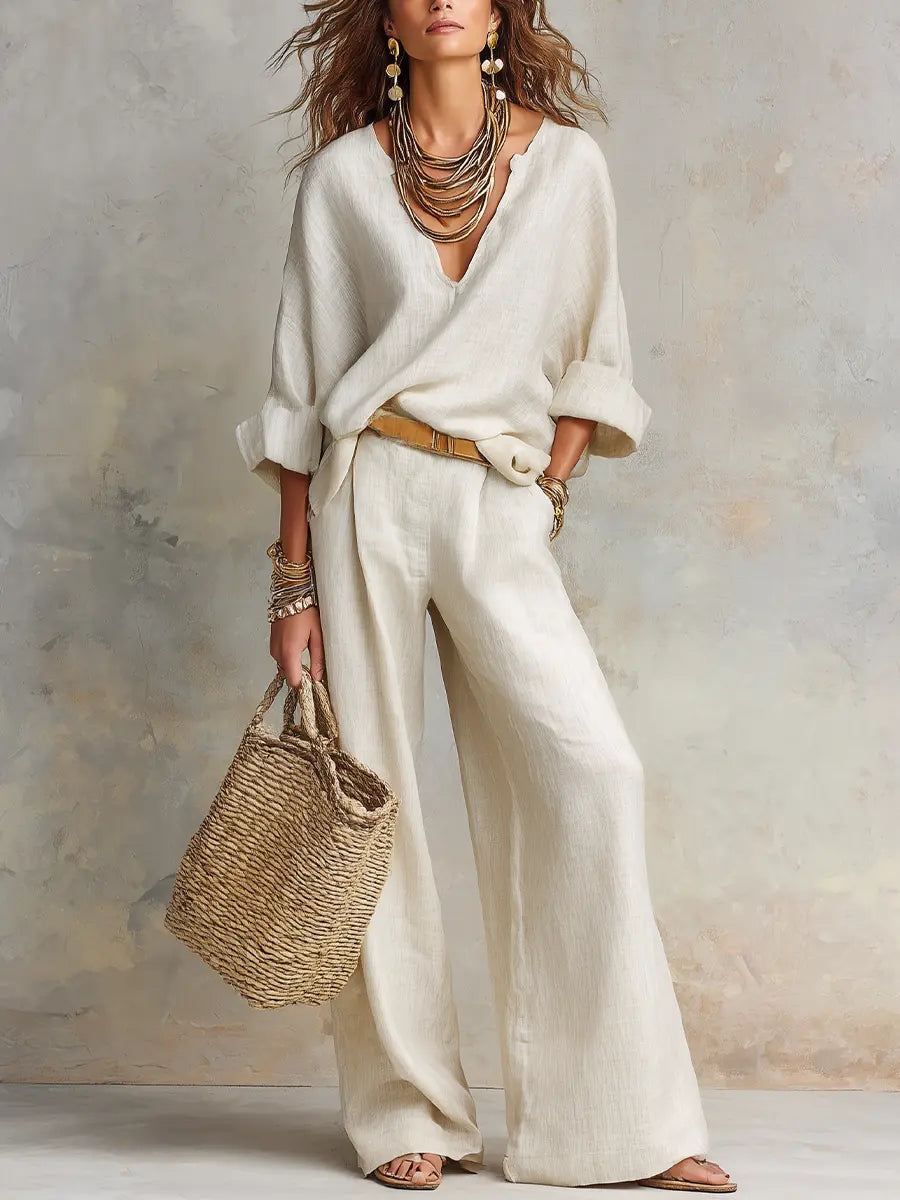 White linen two-piece set with loose V-neck blouse and wide-leg pants
