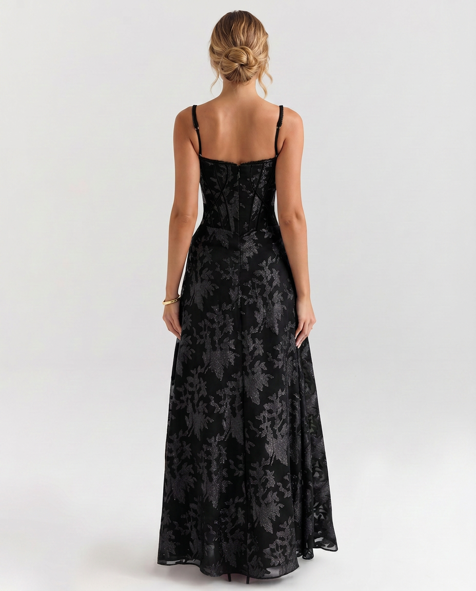 Black maxi corset-style dress with thin straps and corset back panel, flared skirt
