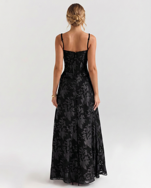 Black maxi corset-style dress with thin straps and corset back panel, flared skirt