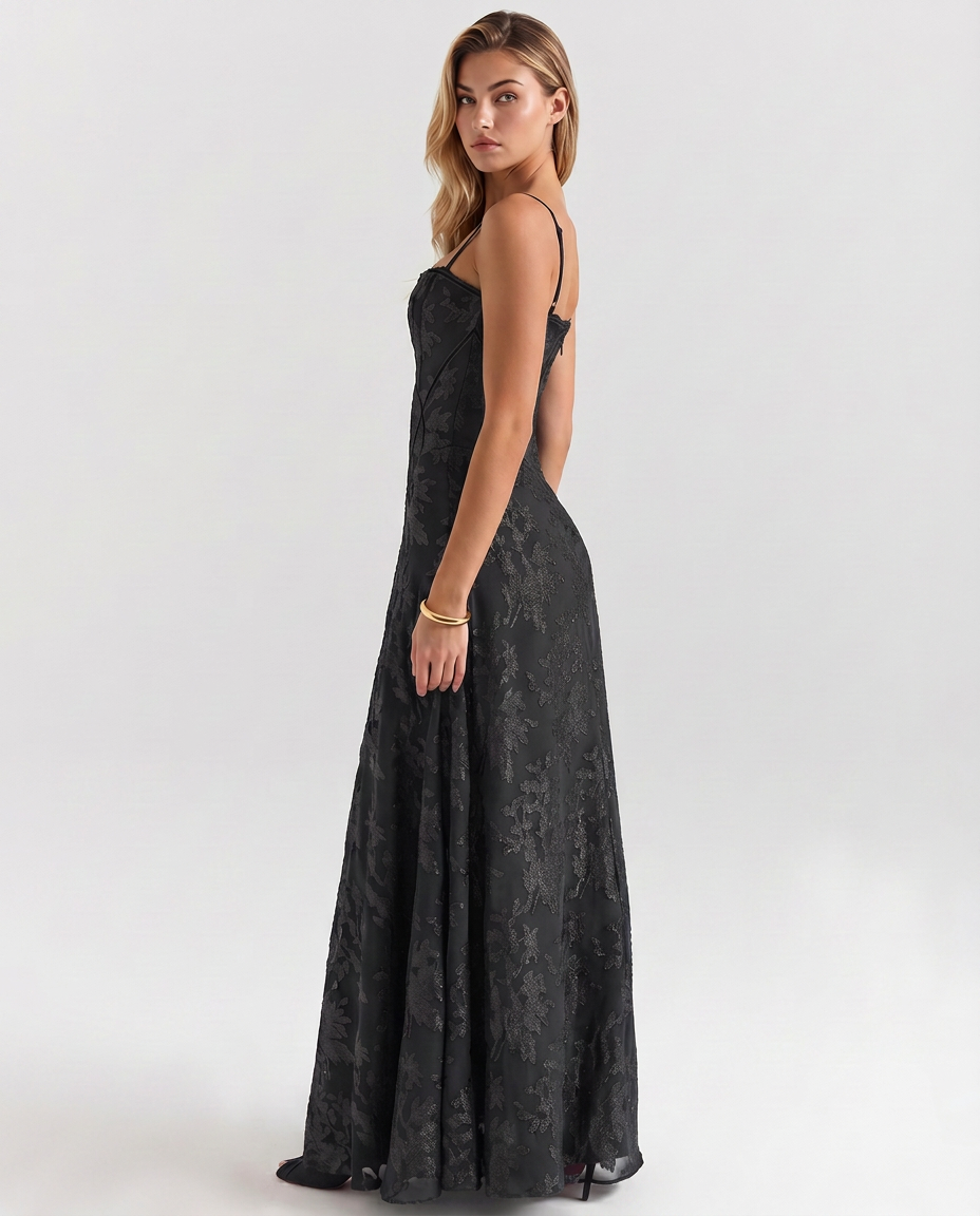 Black maxi corset-style dress with thin straps and textured jacquard fabric, flared skirt
