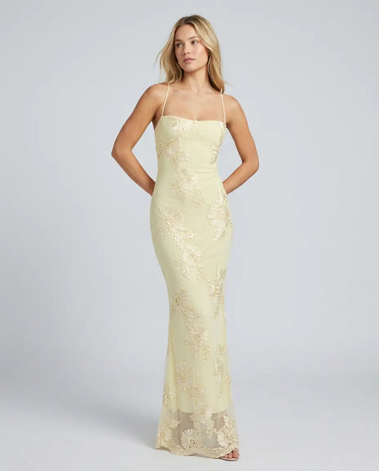 Light yellow fitted maxi dress with spaghetti straps and lace appliqué