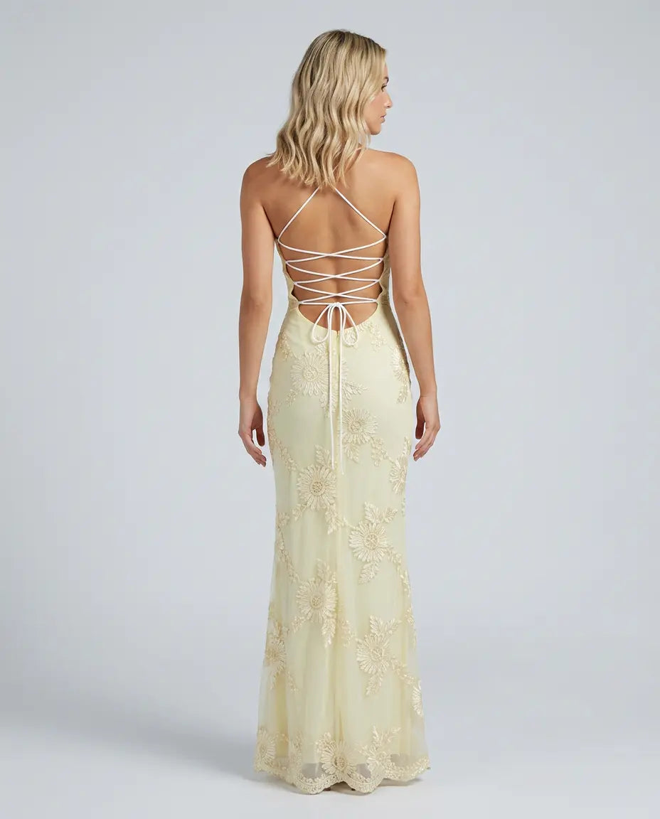 Cream fitted maxi dress back view with crisscross lace-up straps