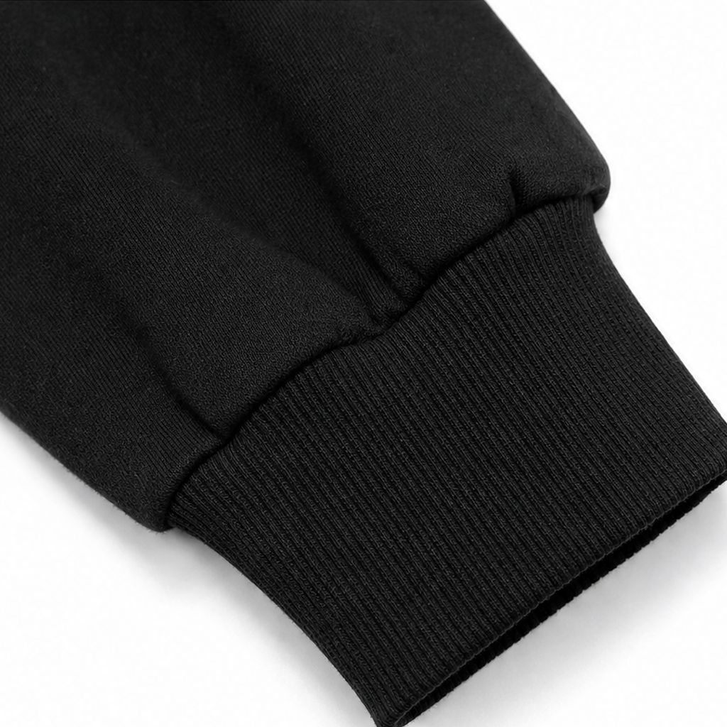 Black knit cardigan cuff and hem ribbing, soft knit texture