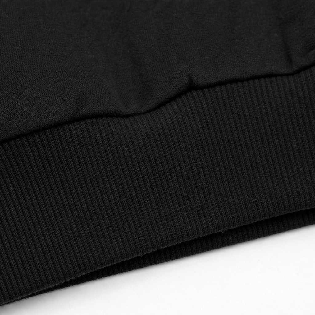 Black ribbed knit hem band on zip-up cardigan