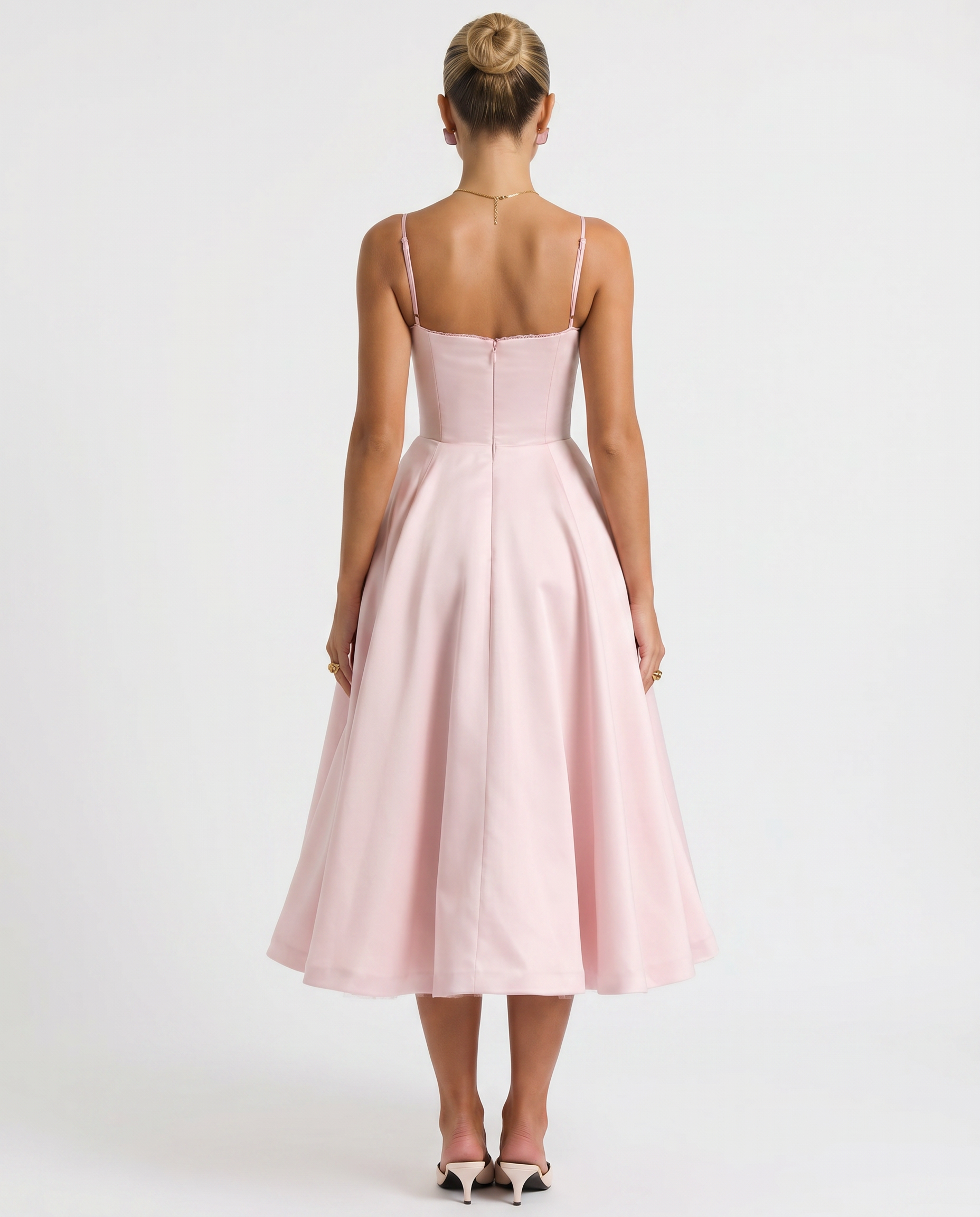 Pink tulle midi dress with open back, spaghetti straps, flared skirt.