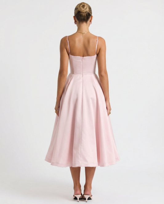 Pink tulle midi dress with open back, spaghetti straps, flared skirt.