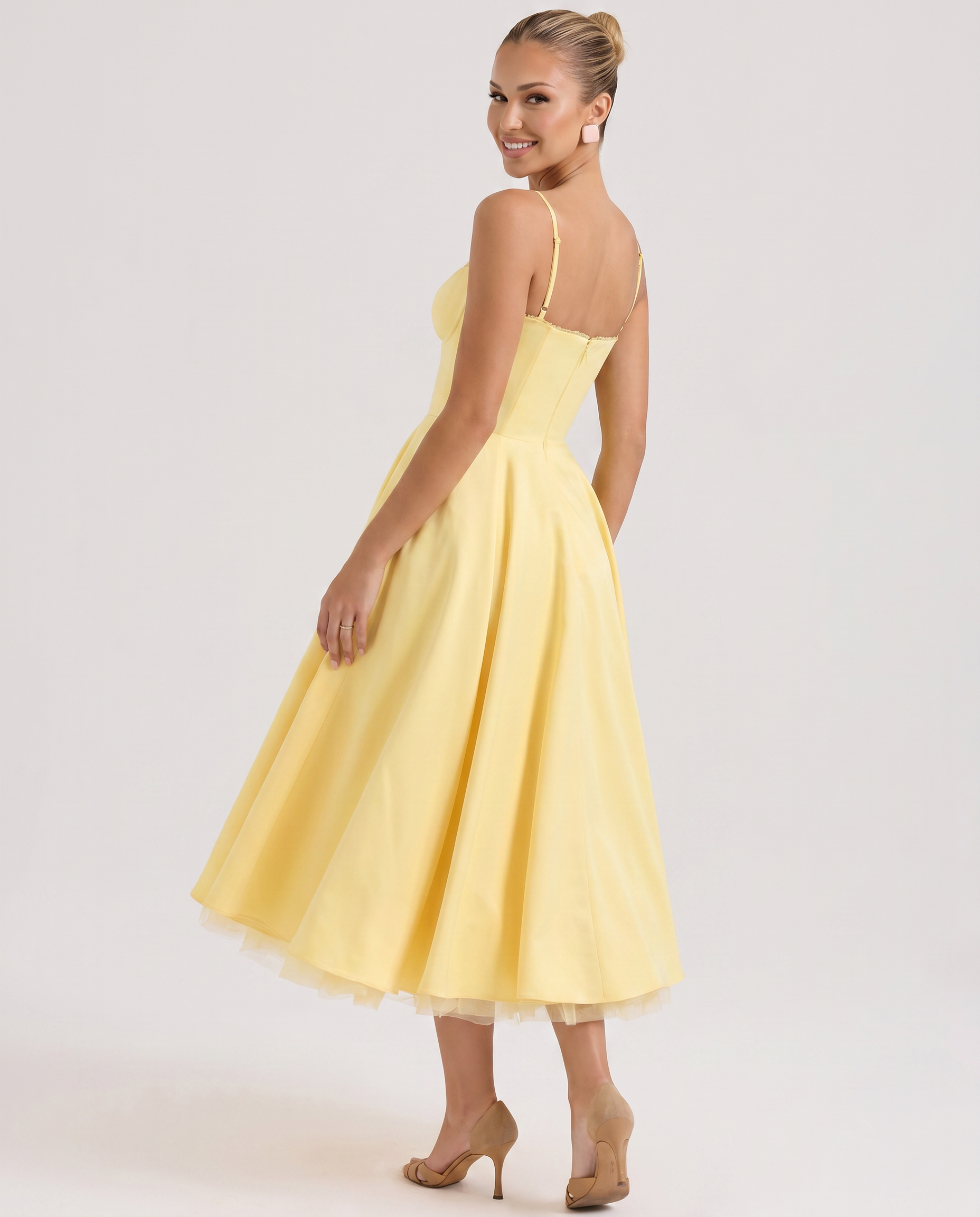Yellow tulle midi dress with underwired bust and spaghetti straps, side view.