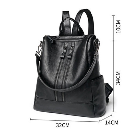 Black leather backpack with front zip, top handles, and shoulder strap; size diagram.