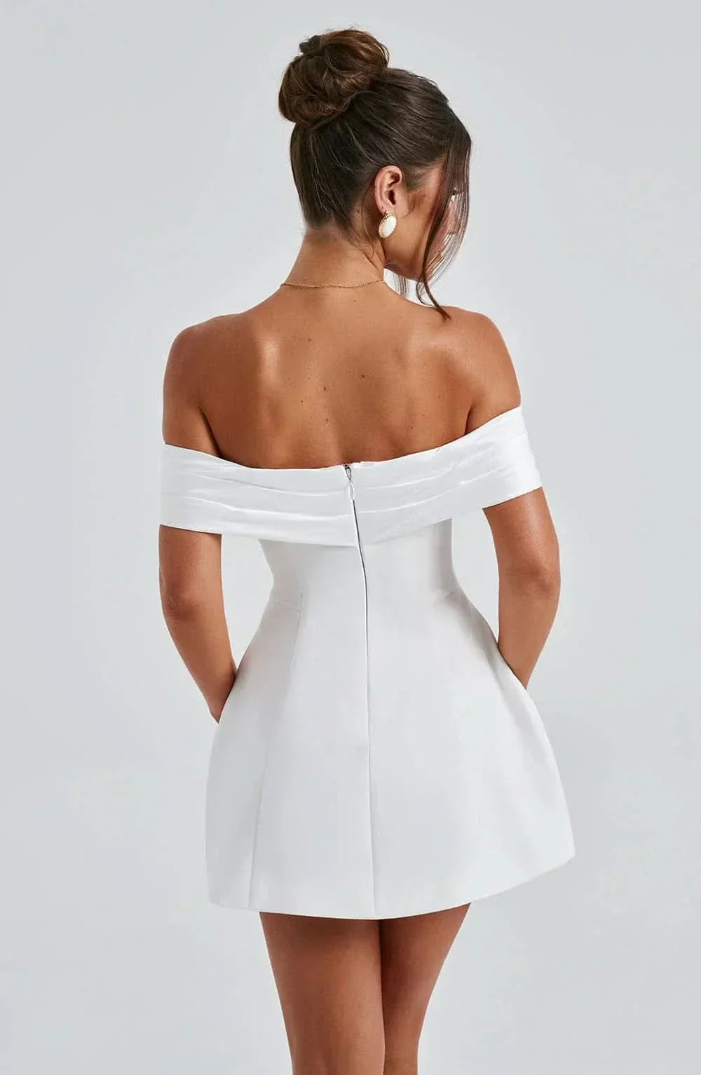 White off-shoulder mini dress with straight back yoke and fitted flare skirt