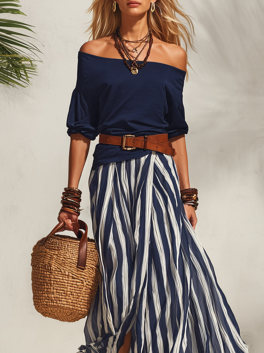 Women's navy off-shoulder chiffon top with blue-striped maxi slit skirt set, close-up
