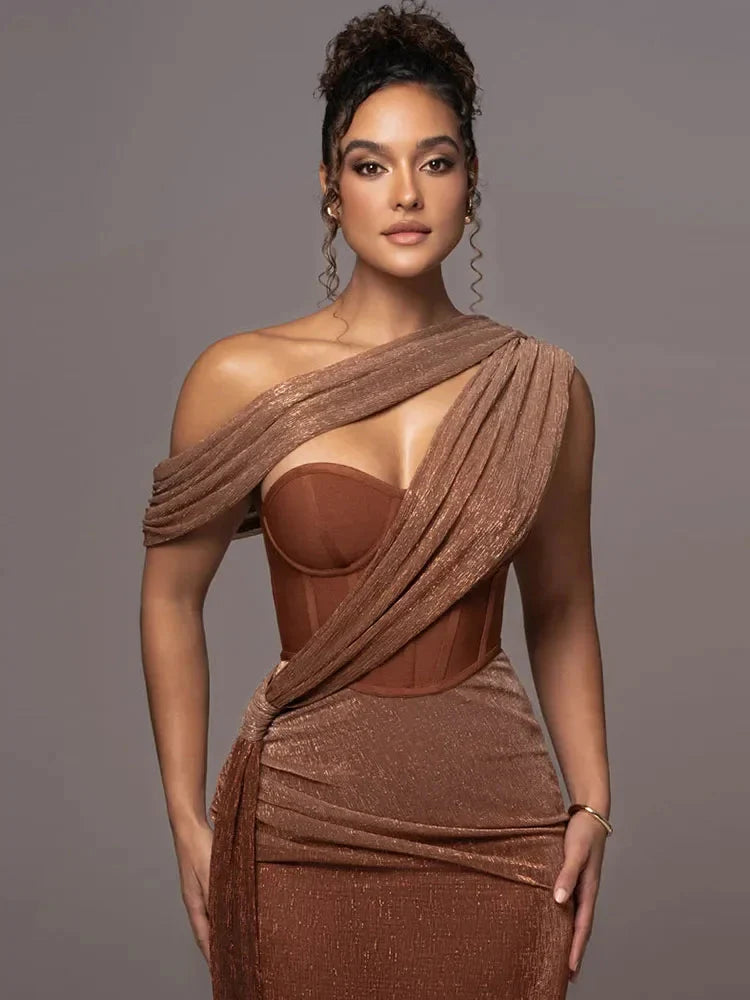Brown one-shoulder maxi dress with draped off-shoulder wrap and fitted bodice
