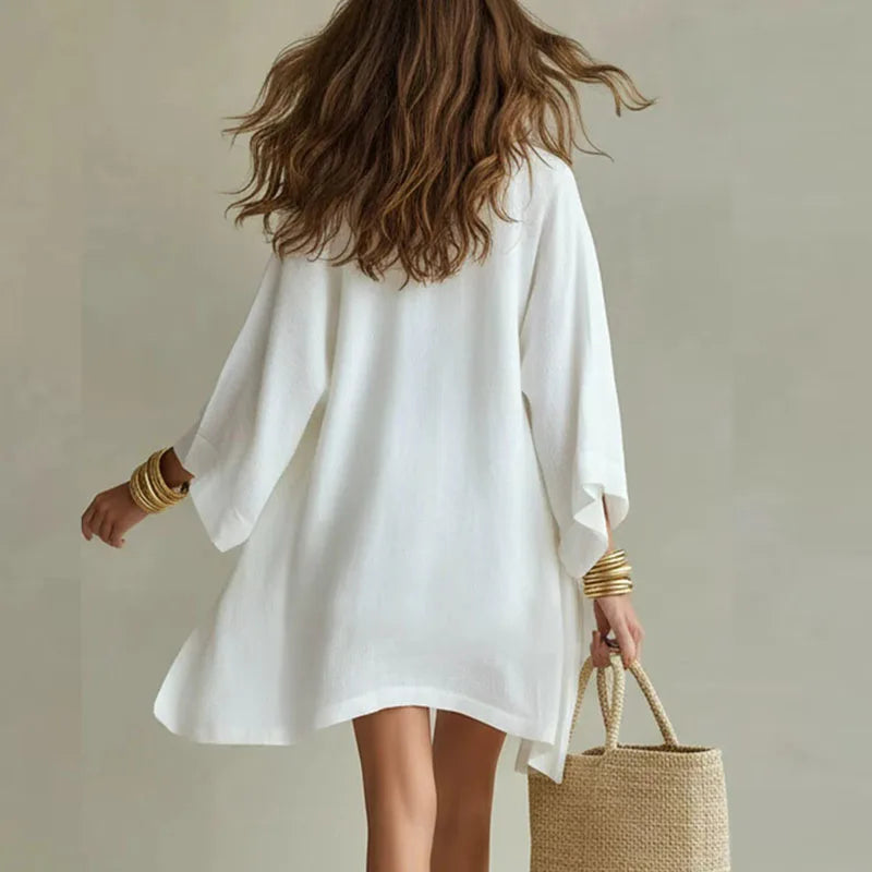 White open-front cardigan with V-neck top and drawstring waist shorts, back view